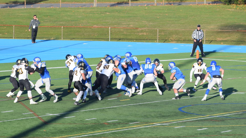 Framingham State defense (white jerseys) stopped Salve Regina on four straight plays in the final two minutes, after the Seahawks had 1st-and-goal from the seven-yard line, to hang on for a 37-34 victory in the New England Bowl. (Photo by Ed Habershaw)