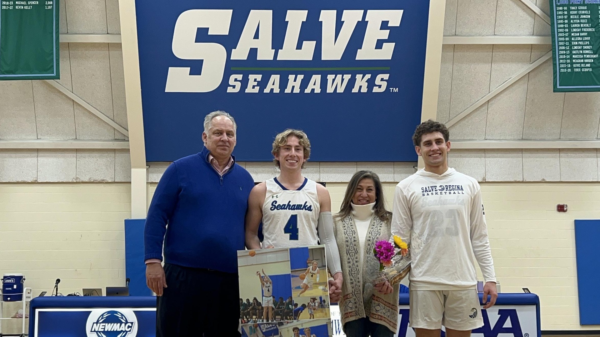 Clay Brochu (#4) joined by his father (Mark), mother (Josie), and brother (Braden) during pre-game ceremonies honoring the Seahawks' senior member.