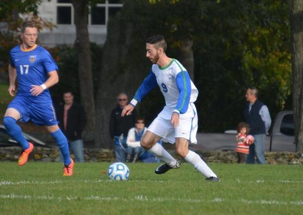Alex Wasilewski (#9) tries to elude Neil Williams in the final regular season game of 2014; Western New England won, 2-0, as Salve Regina settles for the fifth seed in the CCC Championships. (Photo by Brooke Scoca)