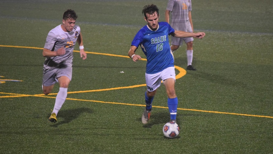 Senior Matthew O'Donnell works the midfield against the Hawks at Bayside Field on Wednesday evening. (Photo by Ed Habershaw)