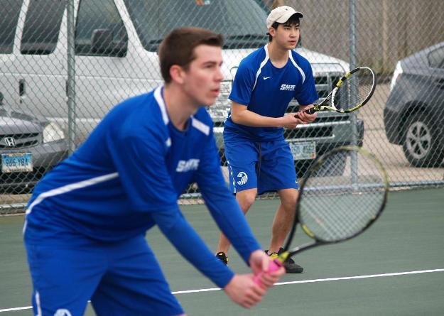 Colin Gunning (foreground) and Khoa Nguyen led 2-1 in their match at No. 1 doubles before Regis won the last seven games.