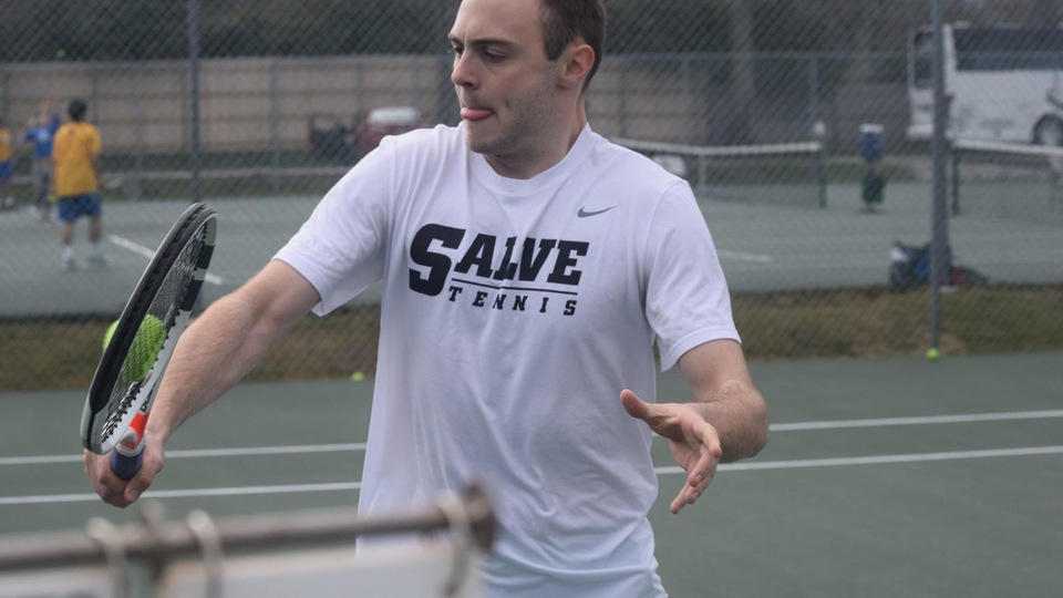 Kevin Brocks meets a backhand volley at the net. (Photo by Ed Habershaw)