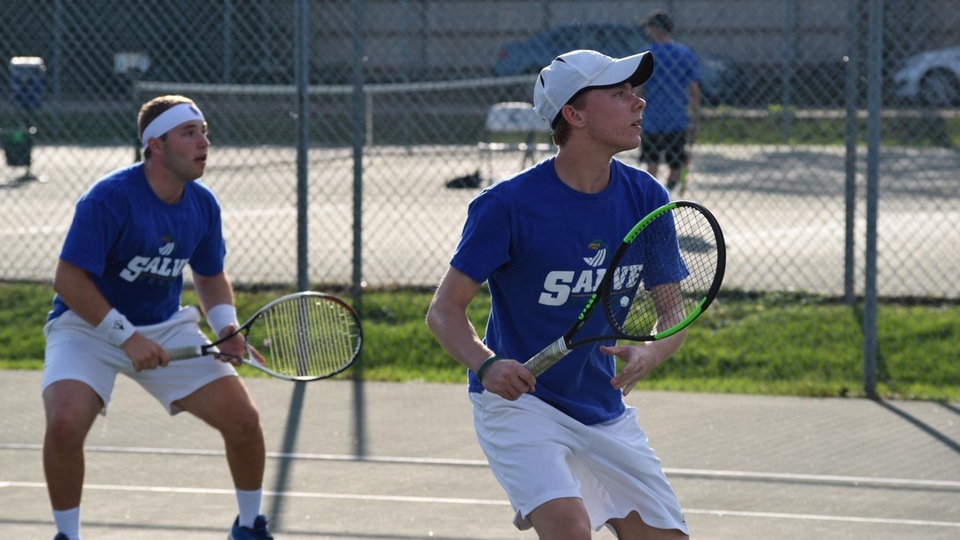 Trevor Jones (left) and Will Chasse won at No. 3 doubles before Chasse contributed his second point with a win at No. 5 singles. (Photo by Ed Habershaw)