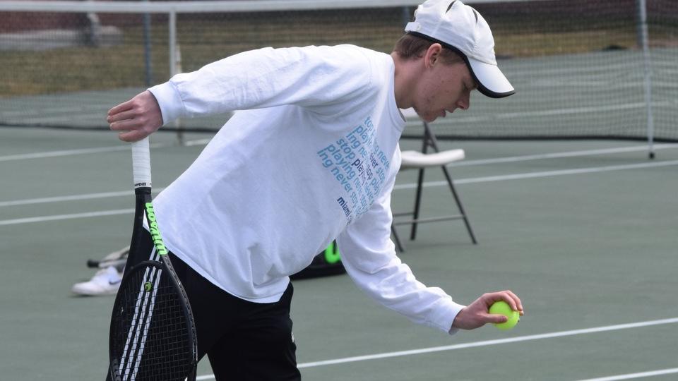 Will Chasse prepares to serve in singles. (Photo by Tyler Benjamin)