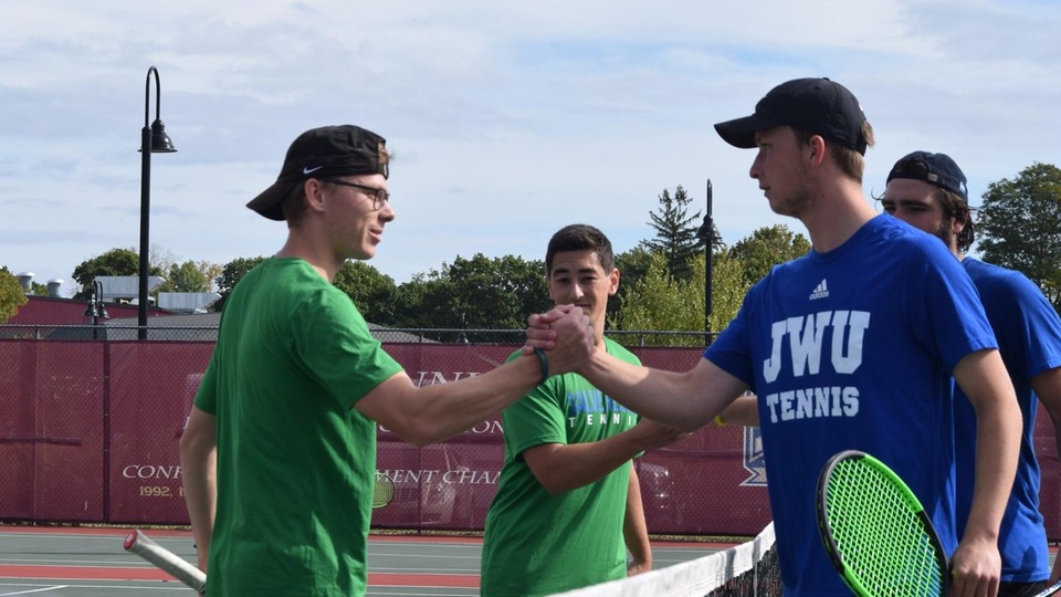 Will Chasse and Benjamin Resende offer congratulations after their No. 1 doubles match with the Wildcats. (Photo by Ed Habershaw)