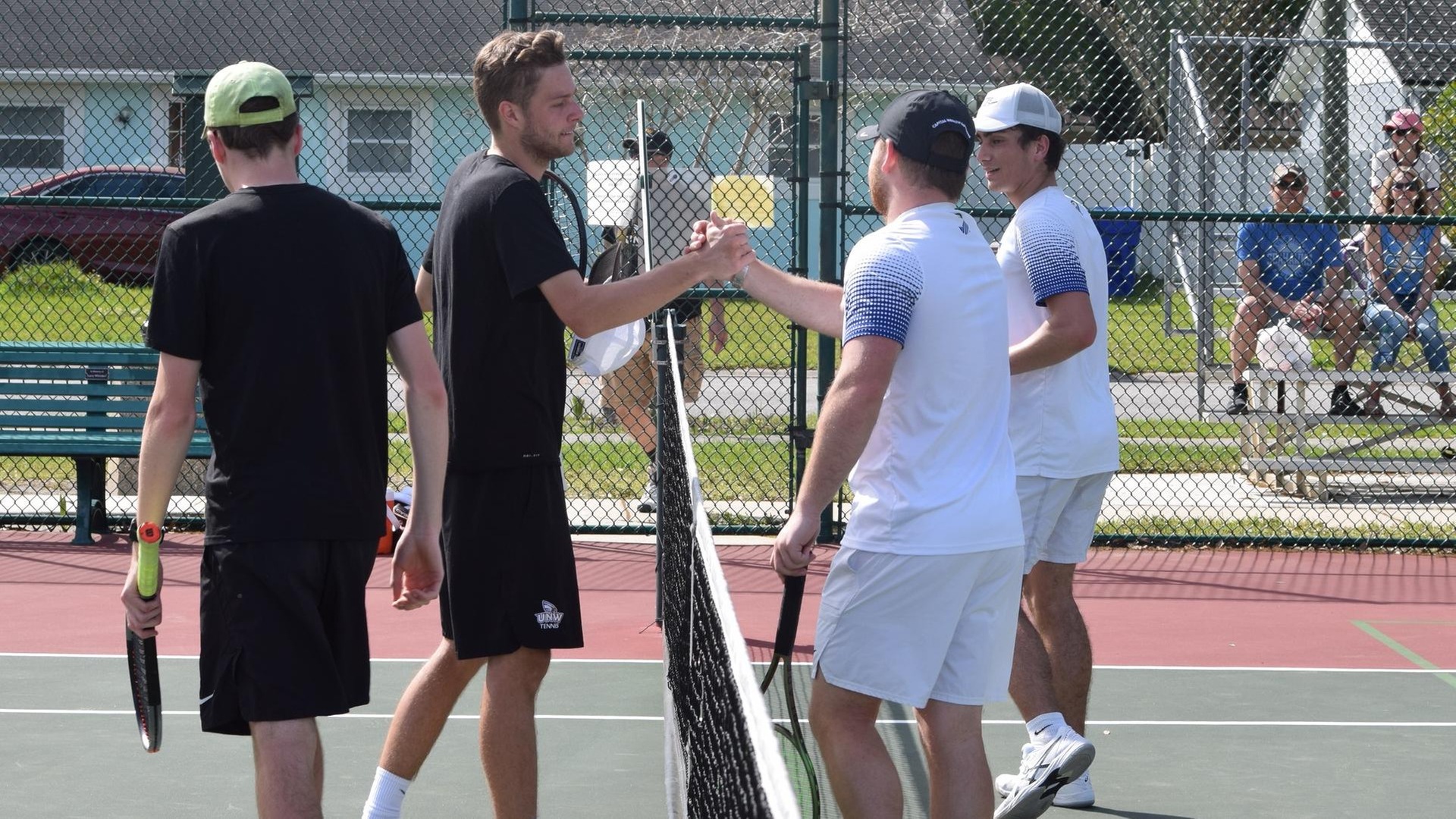 Sam Middleton (second from right) and Alex Colon competed at the top doubles spot and top two singles positions for the Seahawks. (Photo by Ed Habershaw '03M)