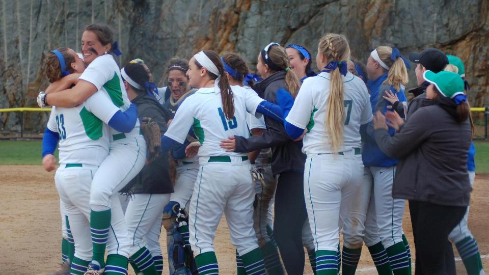 Salve Regina softball players celebrate postseason victory against Endicott on Tuesday; Seahawks are one win away from their fifth championship of all-time. (Photo by Gayle O'Riley)