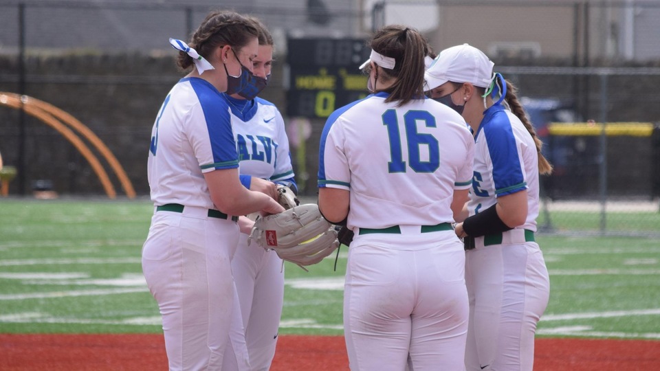 Maddy Fluke (left) lets her infielders know she has the ball and is ready to pitch. (Photo by Jody Mooradian)