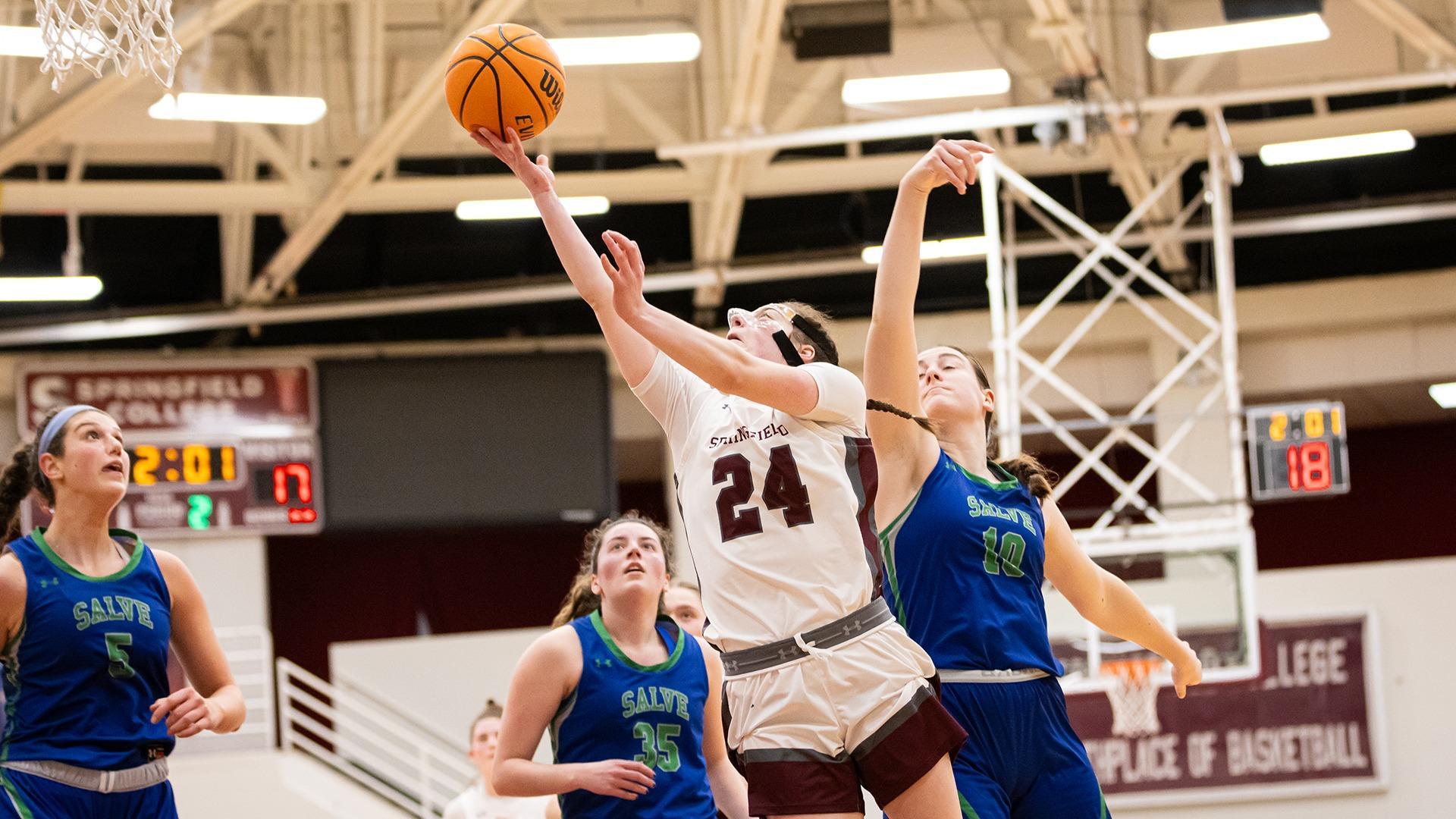 Claire Finney drives to hoop with Sofia Neary, Olivia Martin, Deanna Linscott in her path. (Photo by Dominic Ramalho)