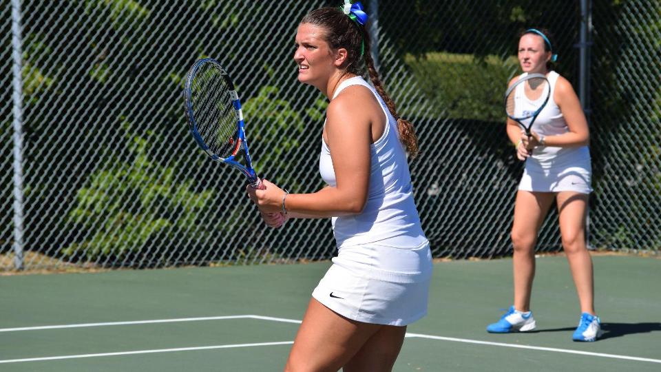 Taylor Amendola (foreground) and Anna Godshalk scored a 9-7 victory at third doubles for Salve Regina on Tuesday. (Photo by Ed Habershaw)