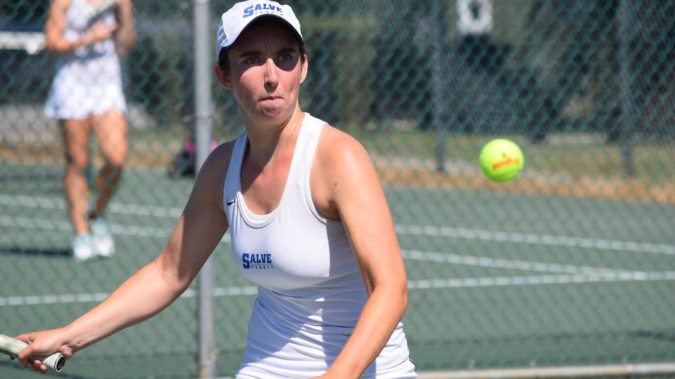 Abigail Burke focuses on the ball during her singles match. (Photo by Ed Habershaw)