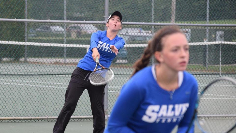 Abigail Burke (background) and Anna Godshalk won in doubles and then singles to combine for three of Salve Regina's six wins on Wednesday. (Photo by Ed Habershaw)