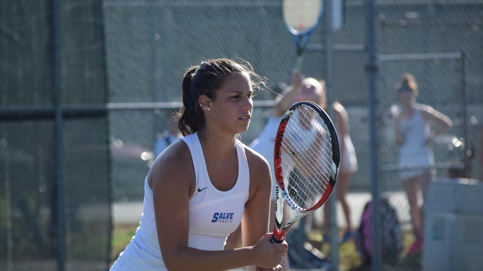 Erin Stangel and Anna Godshalk (serving in background) rallied for a 9-7 victory at third doubles. (Photo by Ed Habershaw)