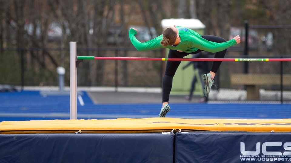 Devin Smith clears the high jump at the Penmen Invitational hosted by Southern New Hampshire University. (Photo by Jen McGuinness)