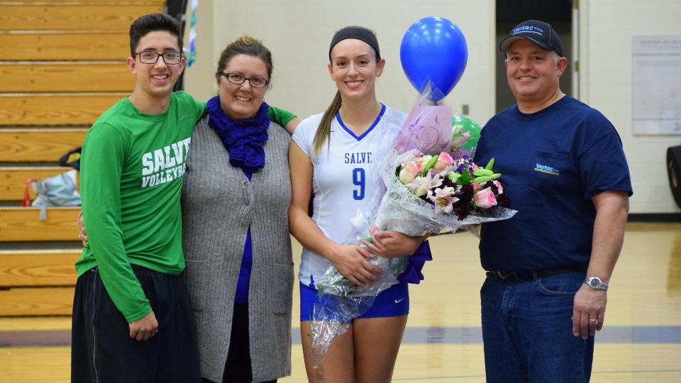 Salve Regina senior Kat Mendes, joined by her family pre-game for a special ceremony.