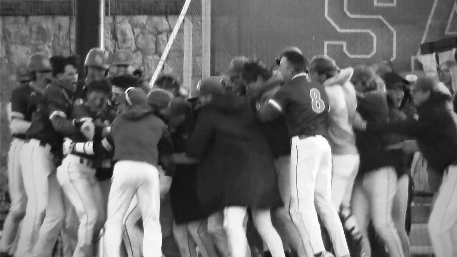 Matt D'Amato mobbed by his Seahawk teammates at the plate after swatting a three-run walk-off home run against the Wildcats on Tuesday evening at Reynolds Field. (Screenshot from live stream)