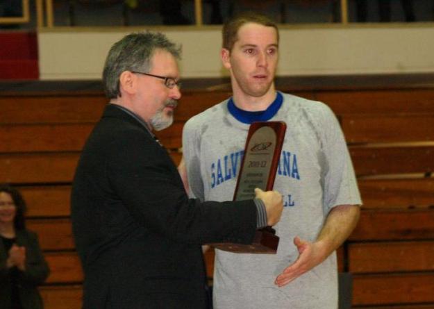 Salve Regina's Ryan Birrell accepts the ECAC runner's up trophy for the Seahawks. Birrell led Salve Regina to a program record for wins in a single season (21) as well as two championship games in 2011-12.