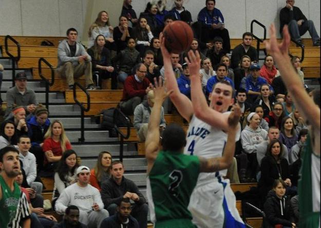 In recent home wins against Roger Williams and Endicott, Patrick Dinneen provided clutch baskets. (Photo by Clare Adams)