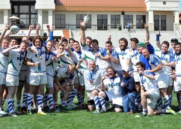 Zackary Moreau (center, hoisting championship trophy) excelled on the field and in the classroom for the national champion Salve Regina men's rugby team.