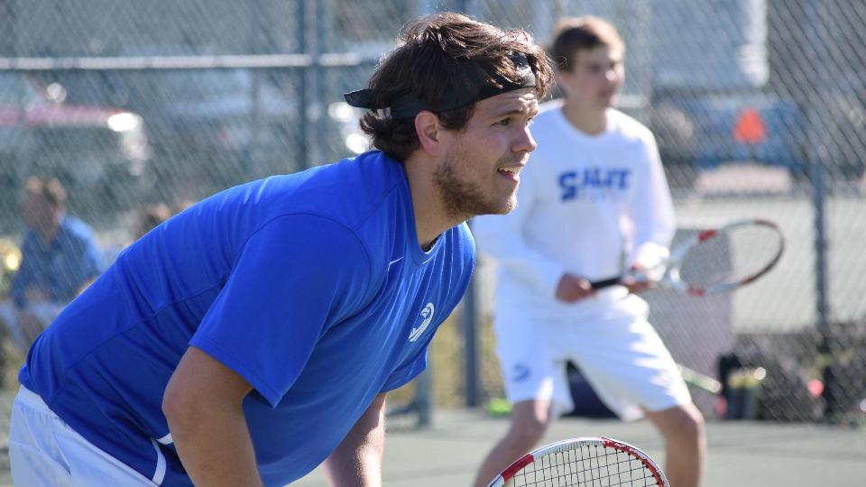 Matt Gingras (foreground) and Will Masse took four games at third doubles against the Bison. (Photo by Ed Habershaw)