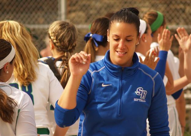 Salve Regina head coach Jessica DePolito exchanges high fives with her team during introductions at Wednesday's ECAC first-round game at Toppa Field.