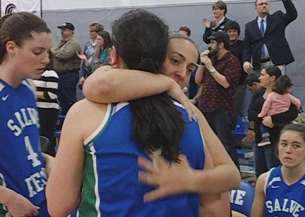 Taylor Windwer hugs Kaitlyn Birrell after the final buzzer of the championship game.