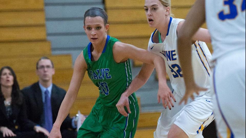 Two first teamers: Meaghan Harden dribbles ball guarded by CCC Player of the Year Chelsea Vujs. The teams will meet in Springfield again for a conference quarterfinal matchup on Tuesday. (Photo by Rob McGuinness)