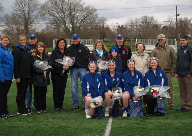 Seahawk seniors (kneeling in front): Grace Kelly, Karley Malenczak, Kayla Sheehan, Josephine O'Reilly - enjoyed pre-game festivities with family, coaches, and administrators before leading Salve Regina to 17-4 victory over Wheelock.