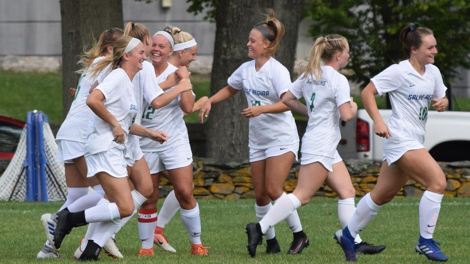 Seahawks (Olivia Pickard, Katie Szemreylo, Molly Leary, Carah Cote, Anna Downes) celebrate a goal early in the season at home. Cote (second from right) had the game-winner on the road against Curry on October 23. (Photo by Ed Habershaw)