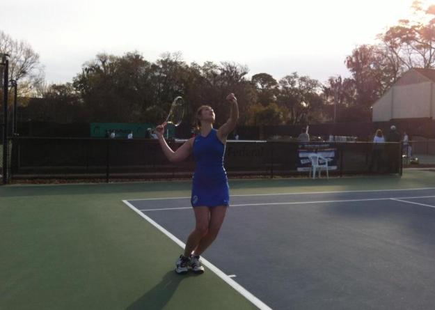 Junior Ana Gwozdz serves during her match at No. 1 singles against Ohio Wesleyan.