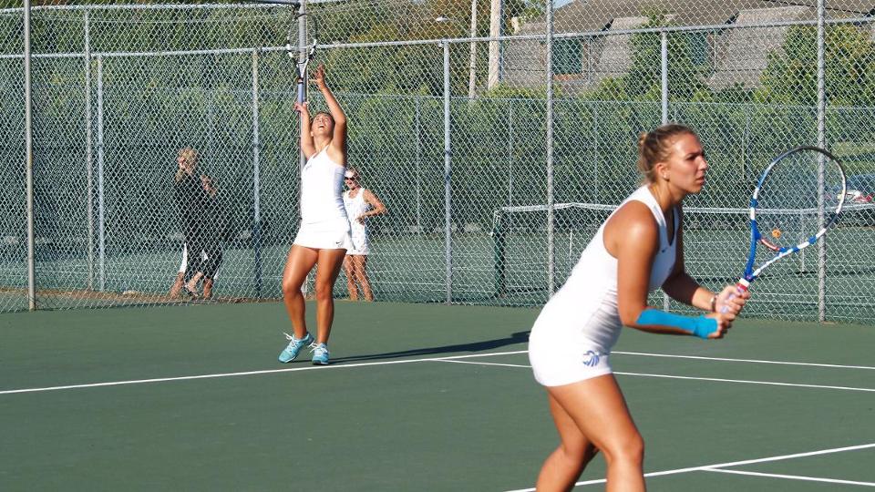 Emma Gruber, Kasey Walther win at first doubles against Western New England. (Photo by Ed Habershaw)