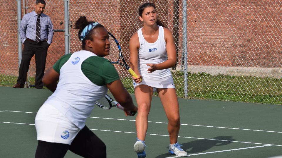 Priscilla Gaspard (foreground) prepares backhand volley as Emma Gruber helps close the middle. (Photo by Ed Habershaw)