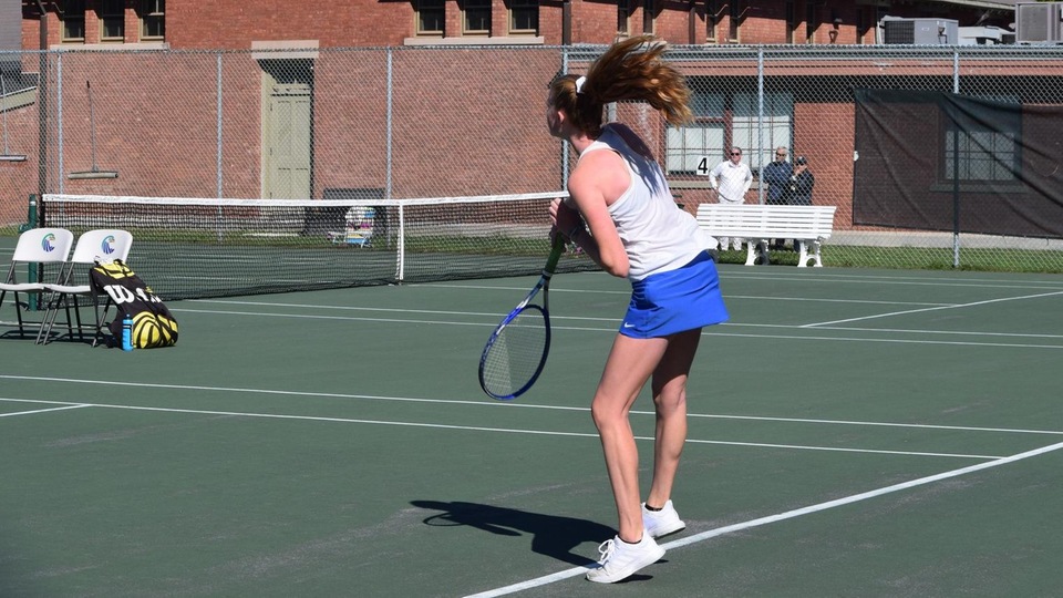 Casey Farrell elevates on her serve during a third-set tiebreak. (Photo by Tyler Benjamin)