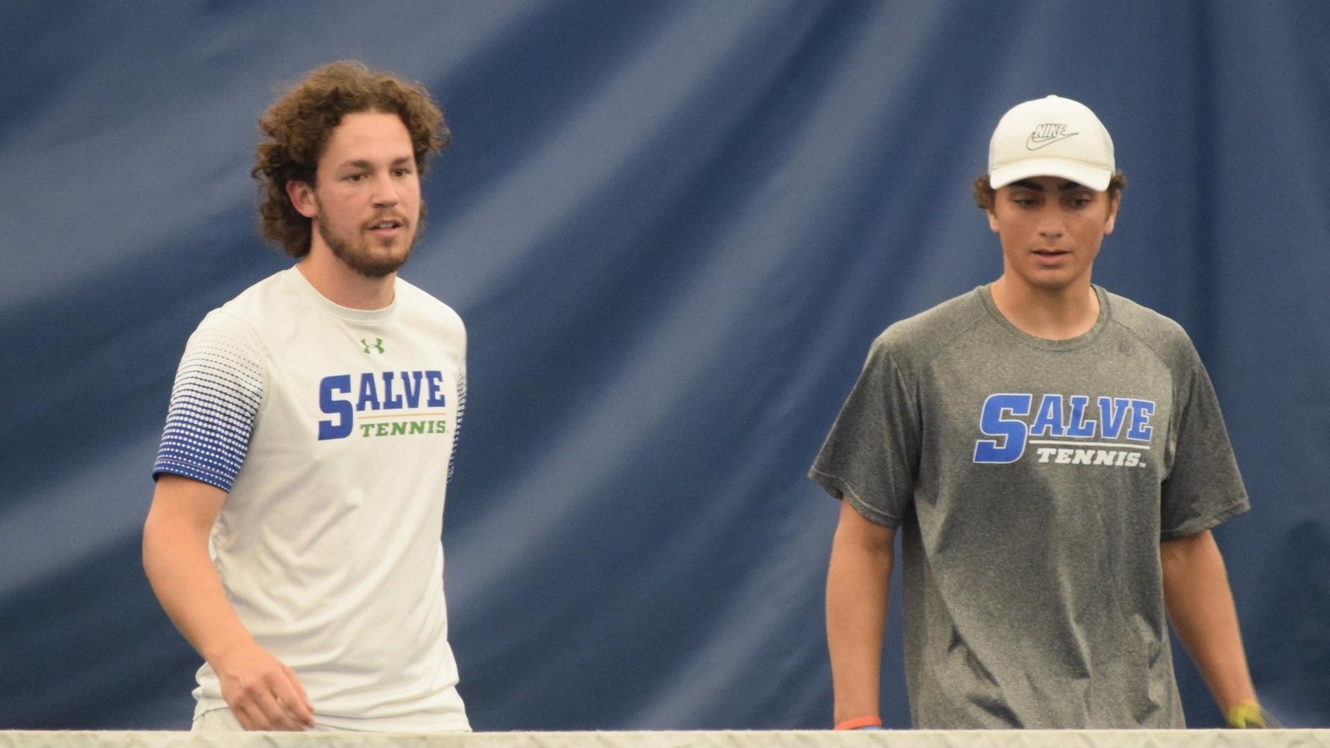 Ned Batstone (left) teamed with Alexander Colon at first doubles and battled to an 8-4 decision before giving Kailas Kahler a competitive match at first singles. (Photo by Ed Habershaw '03M)